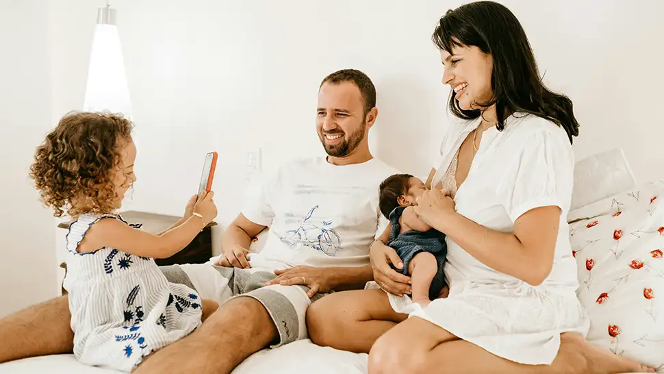 Family laughing together at home