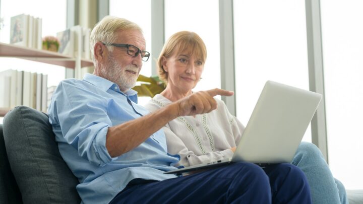 Older couple using a computer