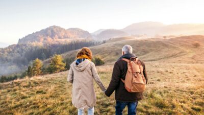 Retired Couple Hiking On a Mountain